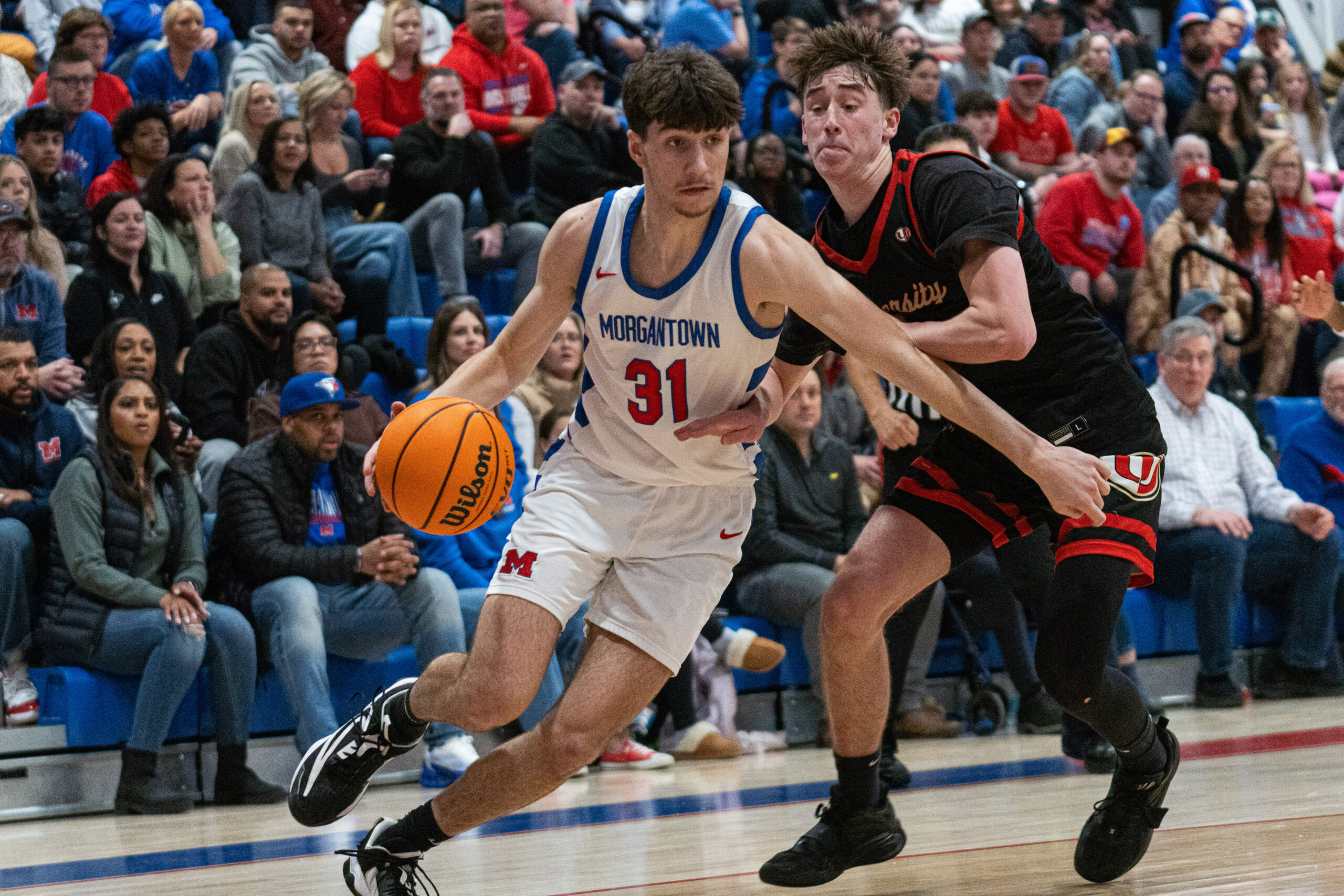 Mohigans outpace University 77-43 in season’s first meeting of rivals